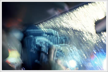 Friend shooting neon and rain, Polk Street, San Francisco, February 16, 1994: click for larger image